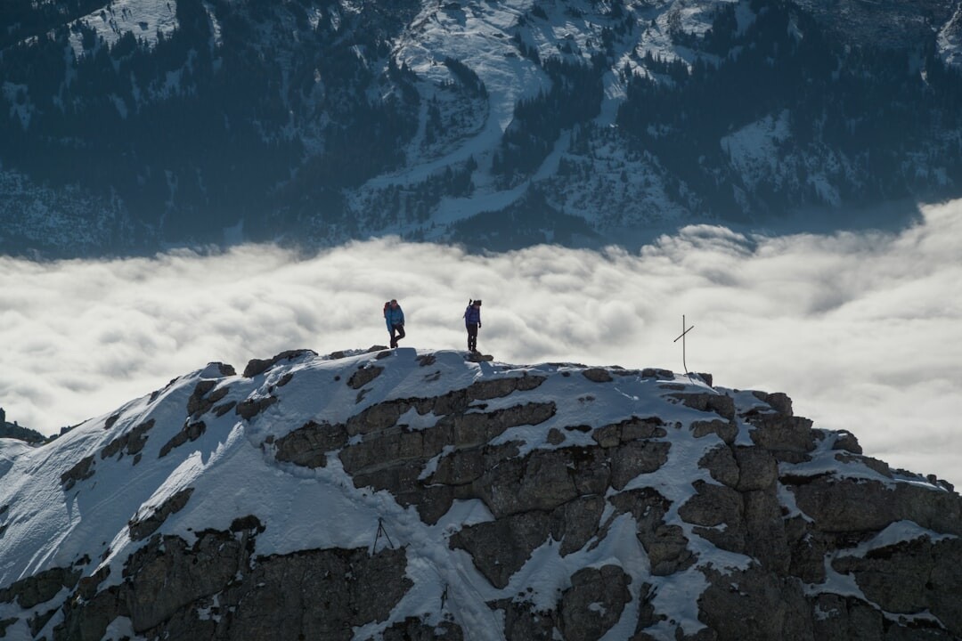 Small film crew filming a documentary outdoors in the Swiss mountains